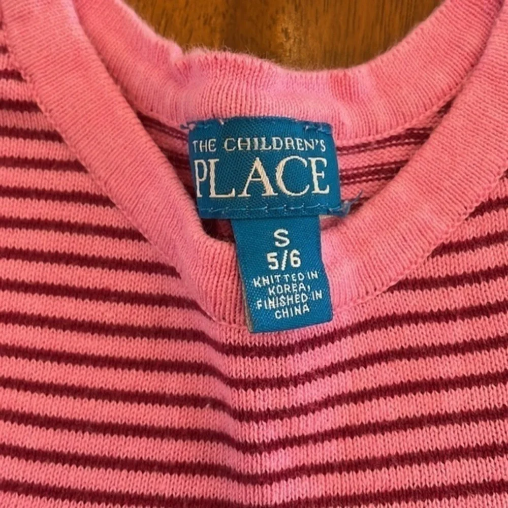 Pink striped sweater 140
